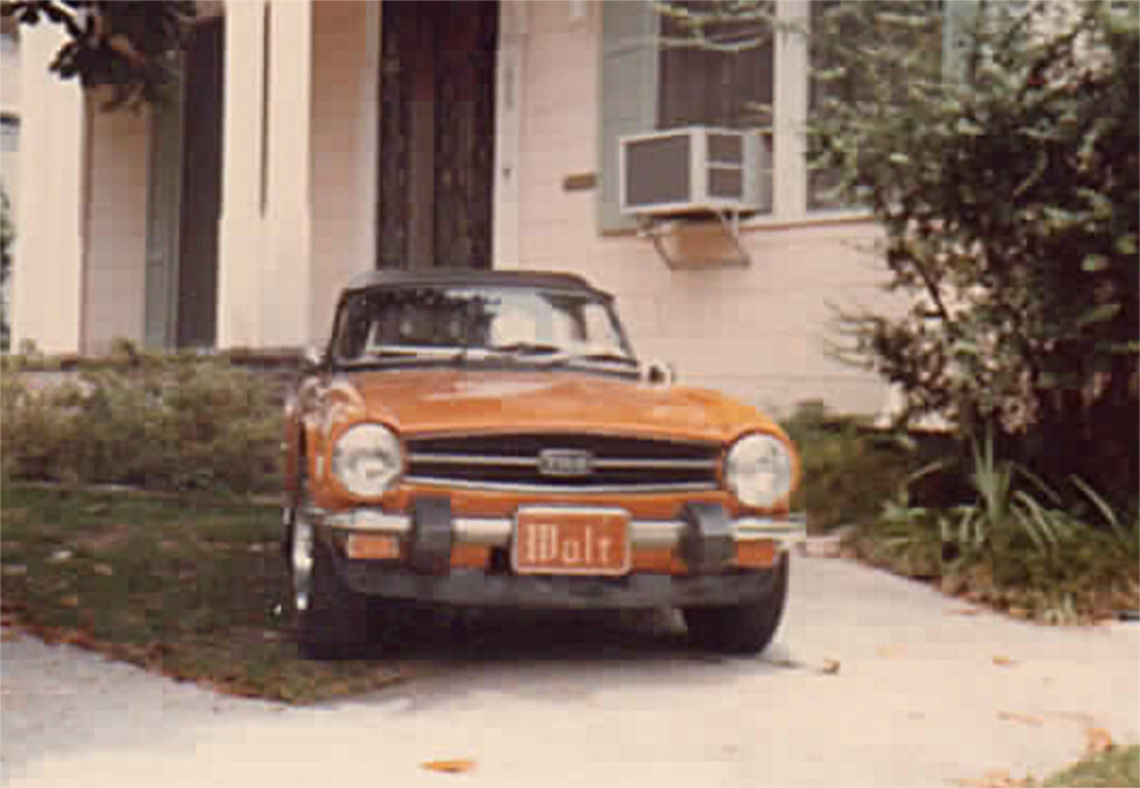 A car parked in front of a house.