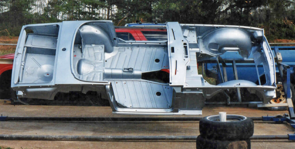 A truck with the doors open and its interior being worked on.