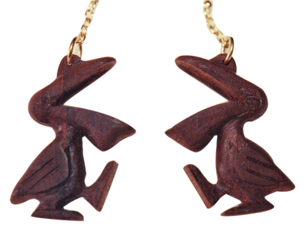 A pair of chocolate rabbits hanging from string.