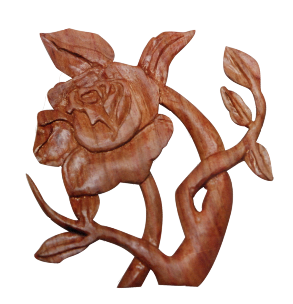 A wooden rose on the branch of a tree.