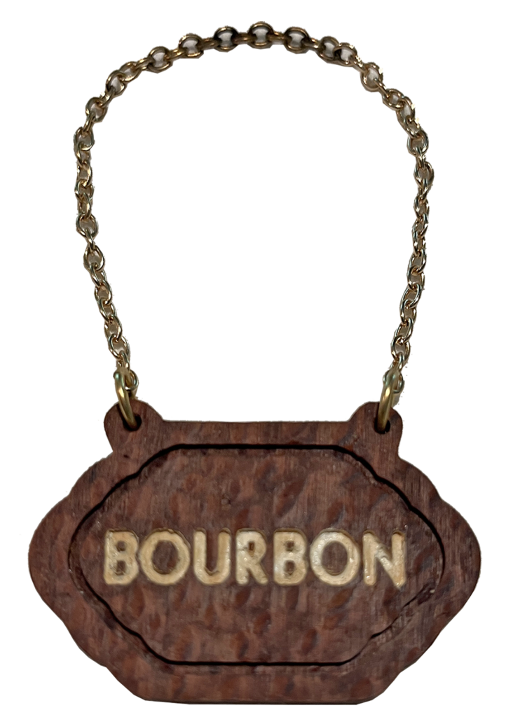 A wooden sign with the word bourbon written on it.