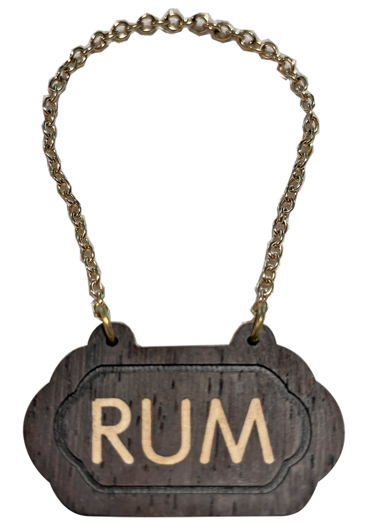 A wooden sign with the word rum written on it.