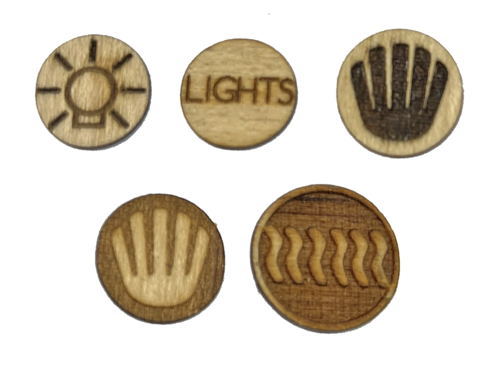 A set of five wooden buttons with the sun and hands on them.