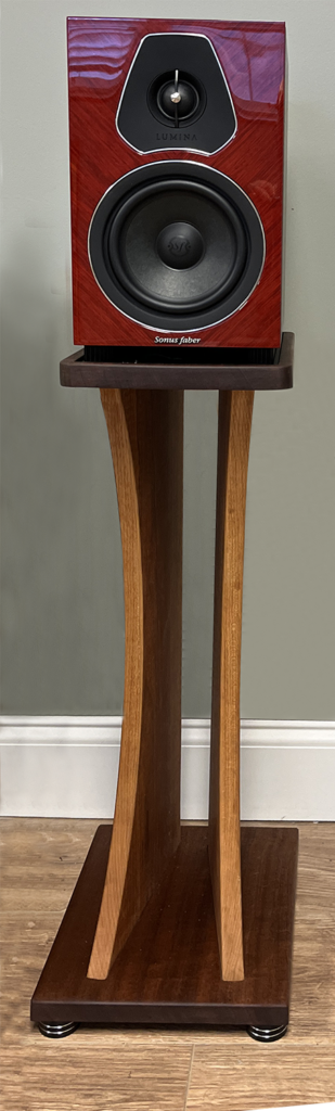 A wooden table with a white top and brown legs.
